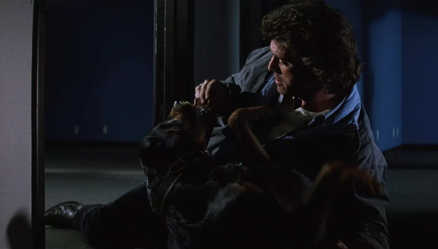 Mel Gibson Cuddleing with a Rottweiler