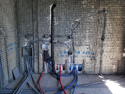 Plumbing pipes inside panel structure