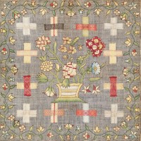 Embroidered darning sampler by Frances Boyce